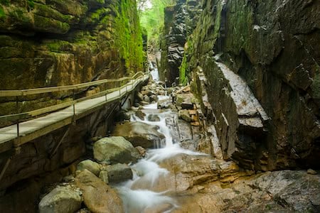 Long suspended bridge over surrounded by rocks in New Hampshire